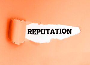 Reputation, written in English on a torn paper, encouraging action.